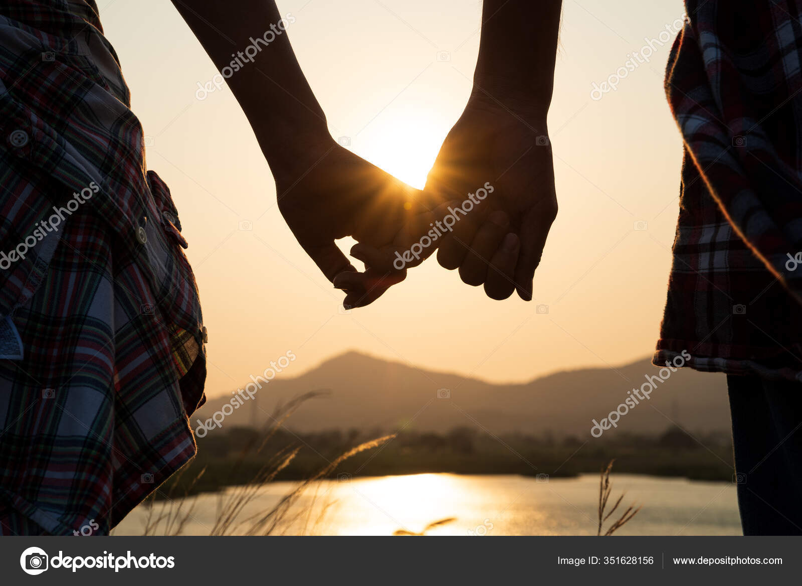 Close Loving Couple Holding Hands While Walking Sunrise Sunset Meadow Stock  Photo by ©spukkato 351628156