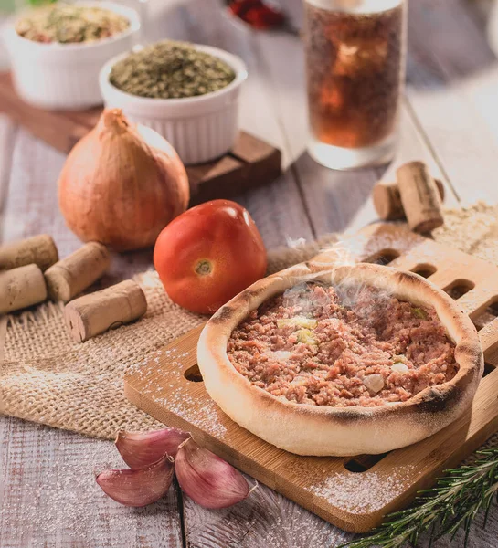 Traditional Arabic Esfiha of open pepperoni (Brazil)