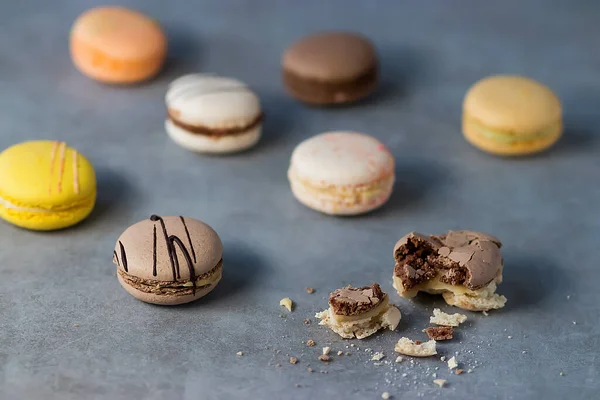 Assorted macaroon cakes on a gray background. Soft focus.