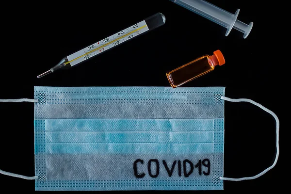 Disposable Medical Mask Syringe Medicine Bottle Thermometer Black Background Coronavirus — Stock Photo, Image