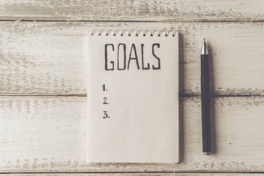 Hedefleri kavramı. Defter ahşap Tablo listesi gol ile. Motivasyon 