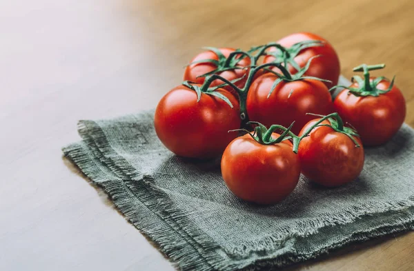 Fresh grape tomatoes with spices for use as cooking ingredients. Healthy eating.