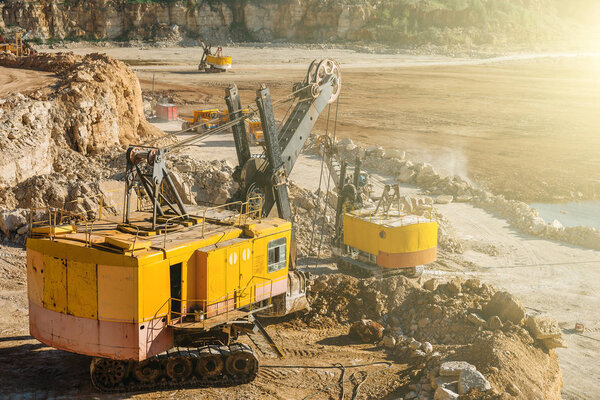 Big industrial vehicles, excavators, quarry equipment concept