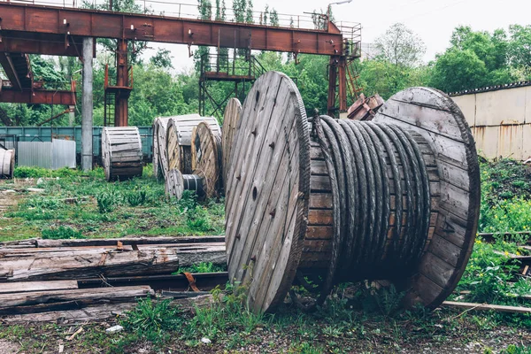 Industrial landscape, wood material rusty steel cable Coils