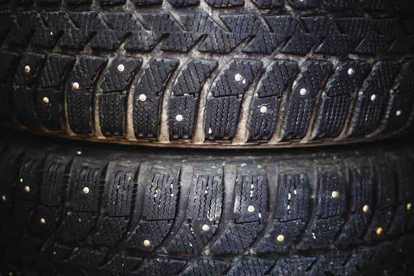 Close-up of winter rubber wheels for a car with spikes — Stock Photo, Image