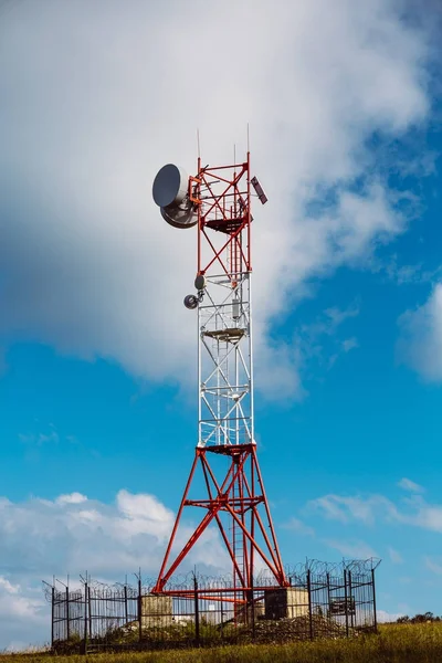 Satellite dish telecom network antenna tower at sky background, communication technology network concept