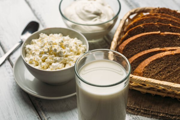 Fresh farm dairy products on wooden background