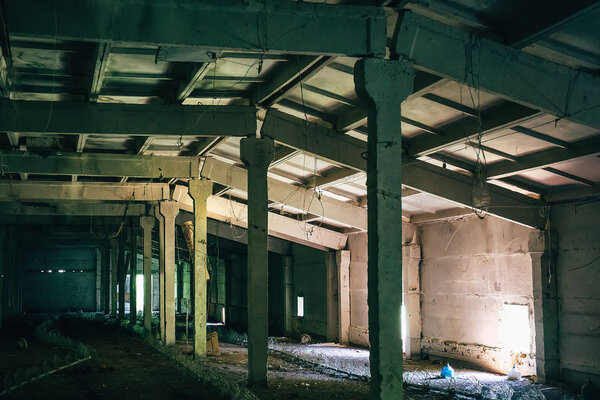 Abandoned factory, warehouse, dark building interior, Apocalypse concept, toned