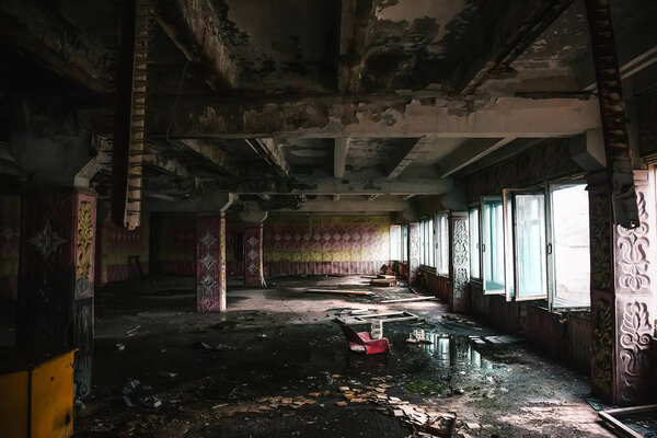 Abandoned metallurgical excavator plant or factory interior, industrial warehouse building waiting for a demolition