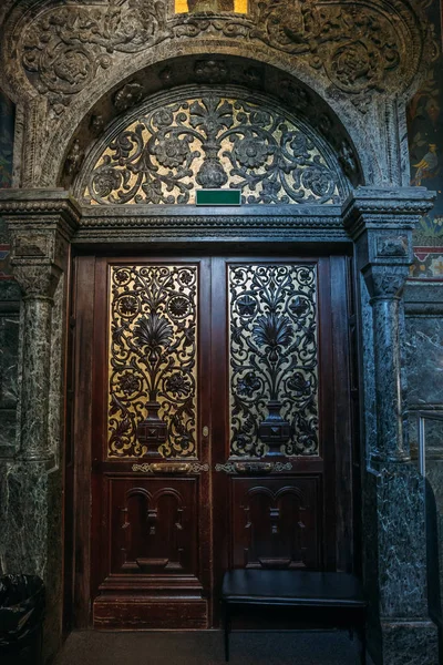 Wooden door in Orthodox Church. Wood carving technic