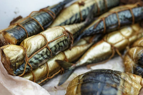 Smoked fish in street market shelf — Stock Photo, Image