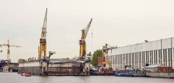 Cargo ship loading cranes in industrial zone on river, freight logistic transportation by water concept — Stock Photo, Image