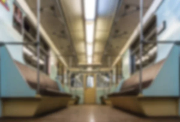 Blurred or defocused interior inside empty metro train wagon — Stock Photo, Image