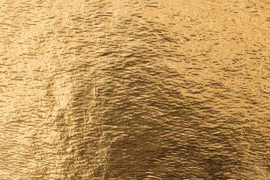 Altın folyo arka plan, parlak metalik doku 