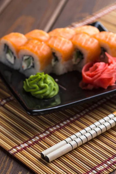 Sushi roll set, California rolls and sticks, vertical image