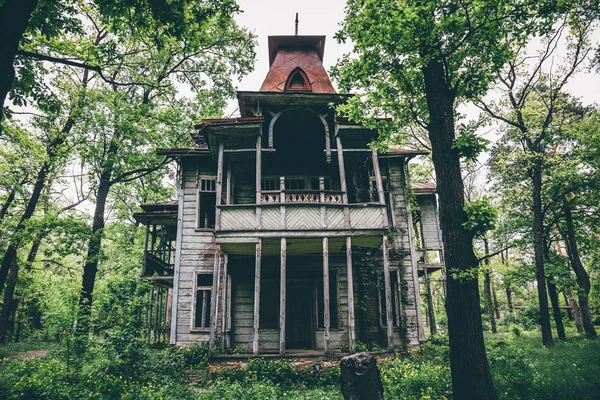 Old creepy wooden abandoned haunted mansion