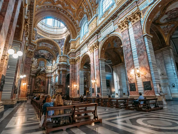 Rome, Italy - Circa October 2019: Interior inside of ancient Catholic Basilica church with columns, old paintings and benches for prayers in center of Rome — Stock Photo, Image