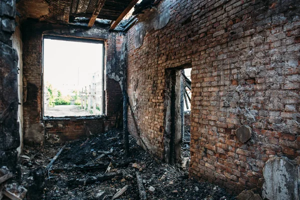 Burned house interior after fire, ruined building room inside, disaster or war aftermath concept — Stock Photo, Image