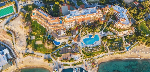 Aerial panoramic view of big Hotel with pool on sea coast with blue mediterranean sea water, drone panorama from above of Cyprus resort — Stock Photo, Image