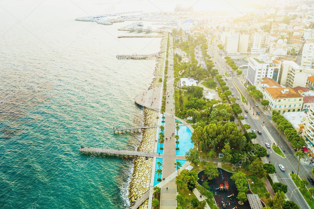 Aerial view of Molos promenade in Limassol, Cyprus in sunlight, drone photo