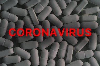 Coronavirus - red text on black and white medication drugs tablets background. 2019-nCoV WUHAN virus concept clipart