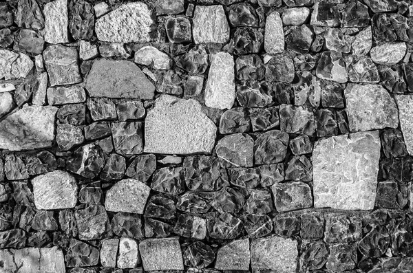 Fragment of old brick wall with river stones texture white grey brown black green blue lime yellow orange maroon violet pink turquoise colored background, different type of stones mosaic surface — Stock Photo, Image