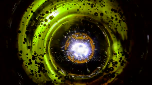 Abstract bubbles in water like in space against green lime red orange violet pink blue multicolor background, or fizzy water in glass close up — Stock Video