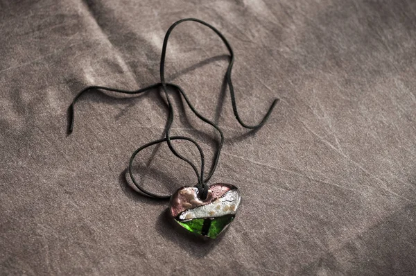 Wooden magic amulet in the shape of heart. Selective focus. — Stock Photo, Image