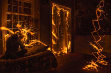 Abstract fireworks flame freezelight on window. Apartment building on Fire at Night time. Fire concept. Azerbaijan clipart