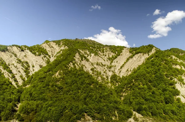 Cycling mountain road. Misty mountain road in high mountains.. Cloudy sky with mountain road. Big Caucasus. Azerbaijan Lahic