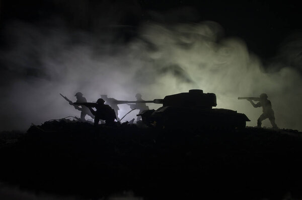 Tanks in the conflict zone. The war in the countryside. Tank silhouette at night. Battle scene.