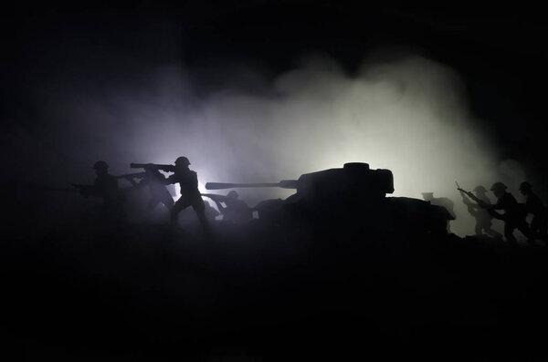 Tanks in the conflict zone. The war in the countryside. Tank silhouette at night. Battle scene.