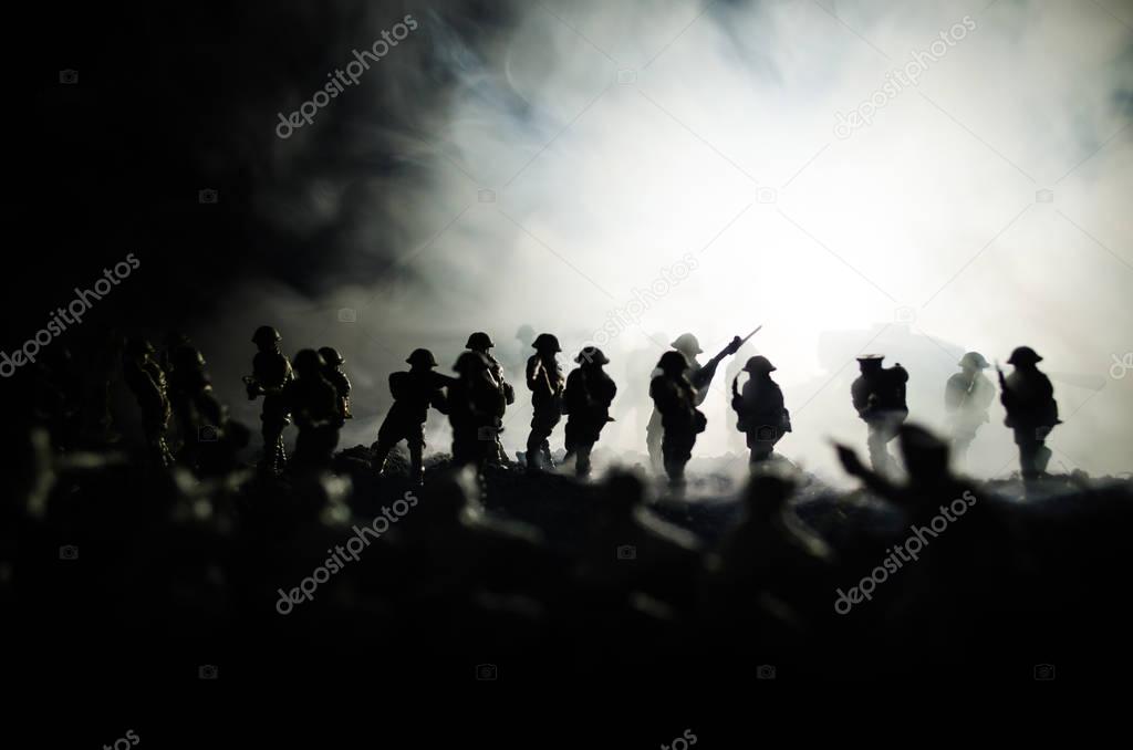 War Concept. Military silhouettes fighting scene on war fog sky background, World War Soldiers Silhouettes Below Cloudy Skyline At night. Attack scene. Armored vehicles