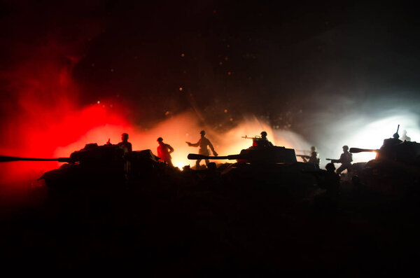 War Concept. Military silhouettes fighting scene on war fog sky background, World War Soldiers Silhouettes Below Cloudy Skyline At night. Attack scene. Armored vehicles.