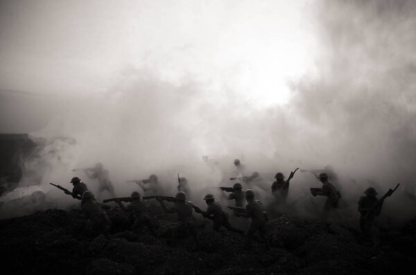 War Concept. Military silhouettes fighting scene on war fog sky background, World War Soldiers Silhouettes Below Cloudy Skyline At night. Attack scene. Armored vehicles. Tanks battle