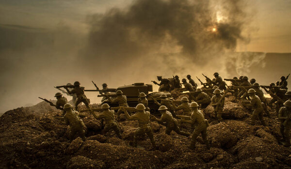 War Concept. Military silhouettes fighting scene on war fog sky background, World War Soldiers Silhouettes Below Cloudy Skyline At night. Attack scene. Armored vehicles. Tanks battle