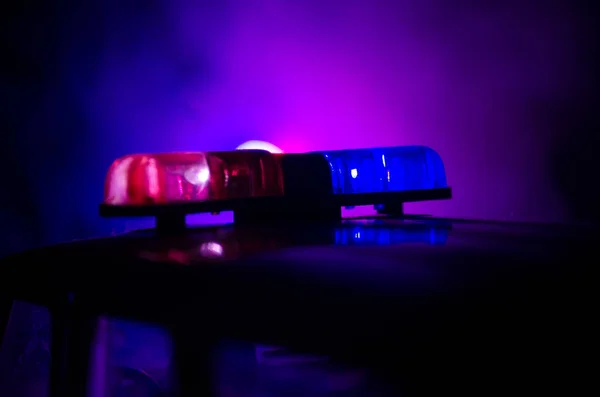 Red light flasher atop of a police car. City lights on the background. Police government concept — Stock Photo, Image