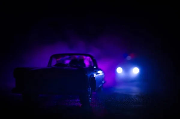 Police car chasing a car at night with fog background. 911 Emergency response police car speeding to scene of crime. — Stock Photo, Image