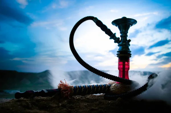 Hookah, traditional arabic waterpipe, direct sunset light, outdoor photo — Stock Photo, Image