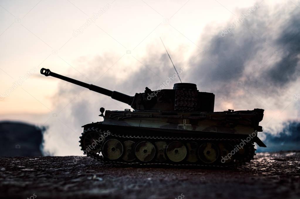 War Concept. Military silhouettes fighting scene on war fog sky background, World War German Tanks Silhouettes Below Cloudy Skyline At night. Attack scene. Armored vehicles. Tanks battle scene