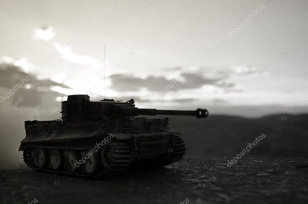 War Concept. Military silhouettes fighting scene on war fog sky background, World War German Tanks Silhouettes Below Cloudy Skyline At night. Attack scene. Armored vehicles. Tanks battle scene