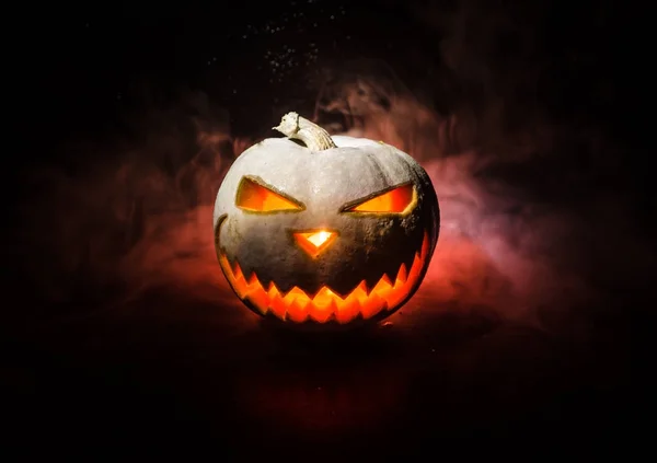 Halloween - old jack-o-lantern on black background. Closeup of scary halloween pumpkins — Stock Photo, Image