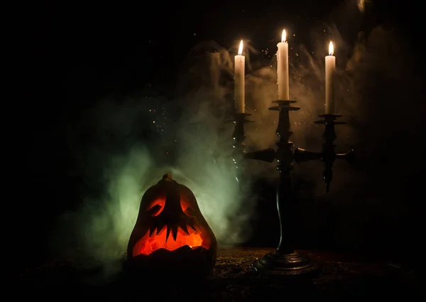 Old ax attached to the tree trunk on horror red foggy background. Scary Halloween theme with maniac killer weapon. Empty space. — Stock Photo, Image