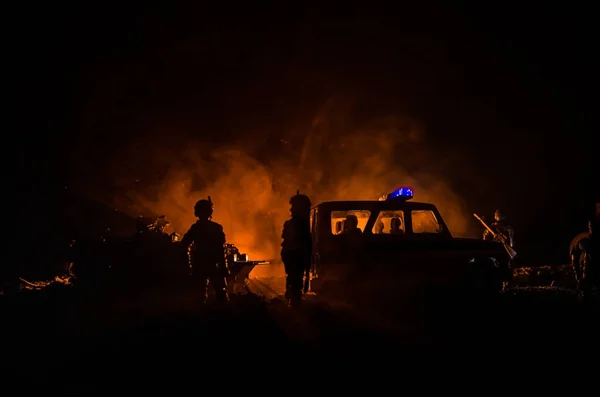 Anti-riot police give signal to be ready. Government power concept. Police in action. Smoke on a dark background with lights. Blue red flashing sirens.