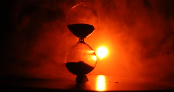 Time Concept Silhouette Hourglass Clock Rotating Smoke Dark Toned Background — Stock Video