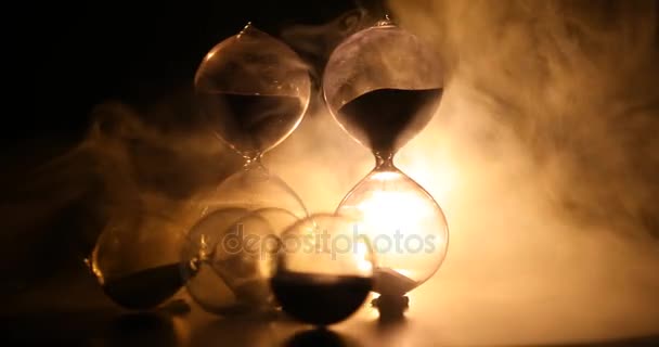 Time Concept Silhouette Hourglass Clock Rotating Smoke Dark Toned Background — Stock Video