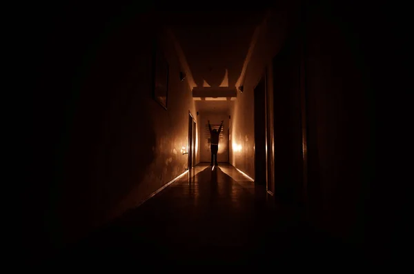 Dark corridor with cabinet doors and lights with silhouette of spooky horror man standing with different poses. — Stock Photo, Image