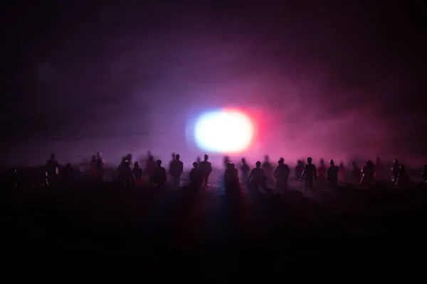 Silhouettes of a crowd standing at field behind the blurred foggy background. Revolution, people protest against government, man fighting for rights — Stock Photo, Image