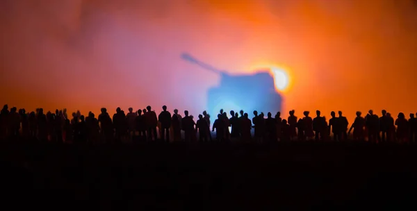 Silhouettes of a crowd standing at field behind the blurred foggy background. Selective focus. Revolution, people protest against government, man fighting for rights. Selective focus — Stock Photo, Image