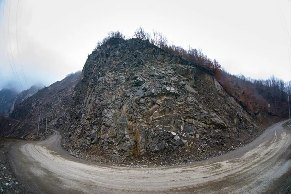 Panorama of the foggy winter landscape in the mountains with snow and rocks, Azerbaijan, Lahic, Big Caucasus — Stock Photo, Image